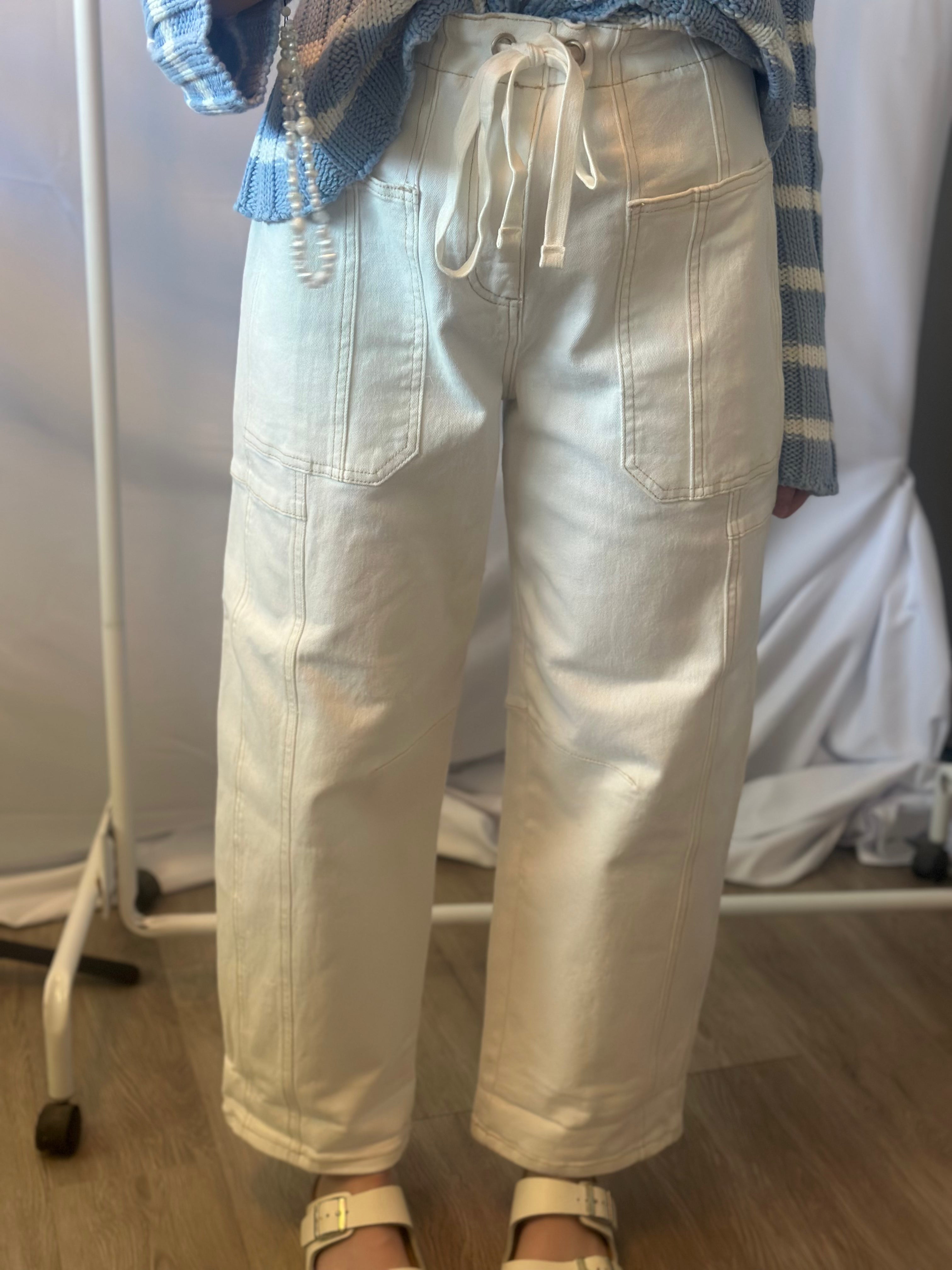 Light-colored pants worn by a person with a blurred background